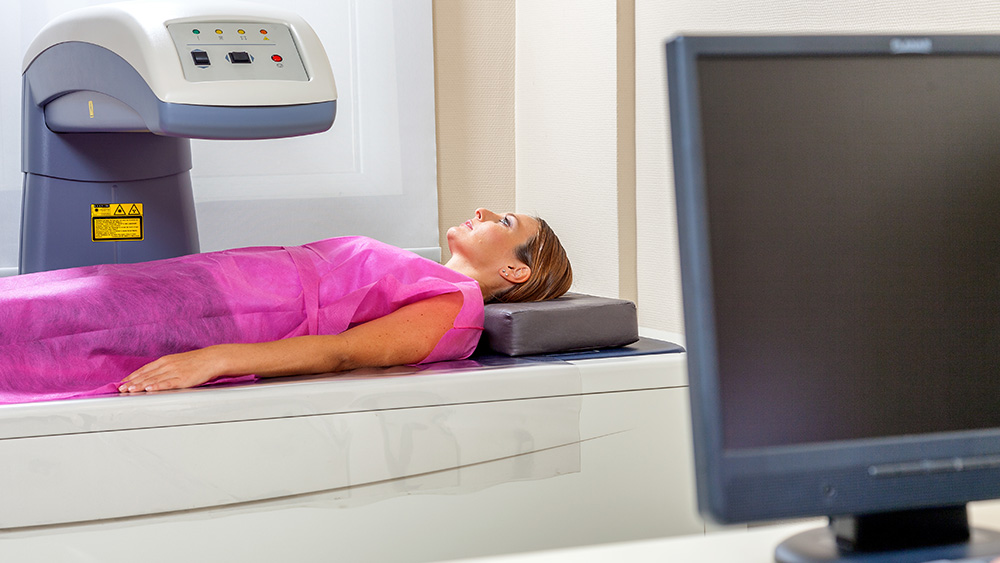 Person taking a bone density test